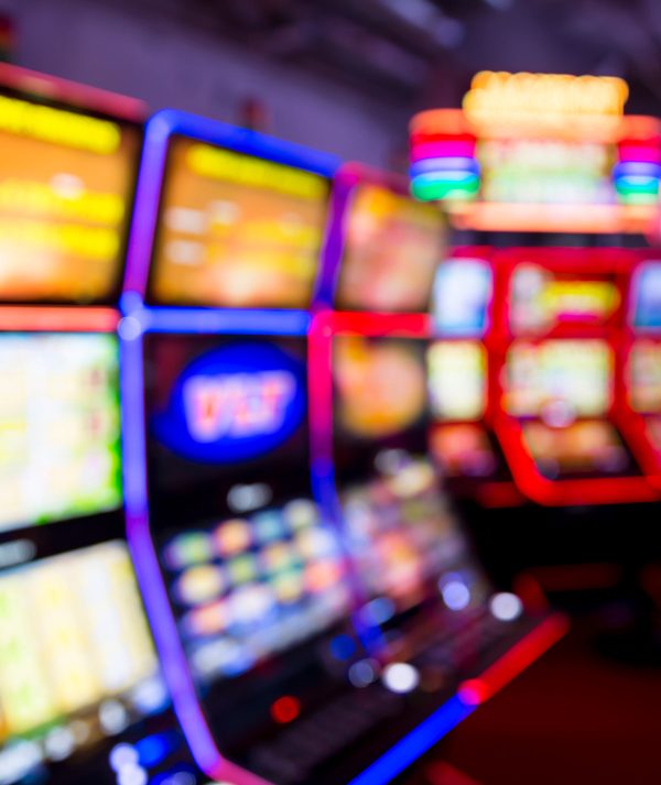 Out of focus blurry image of casino equipment. Blurred slot machines in a casino.